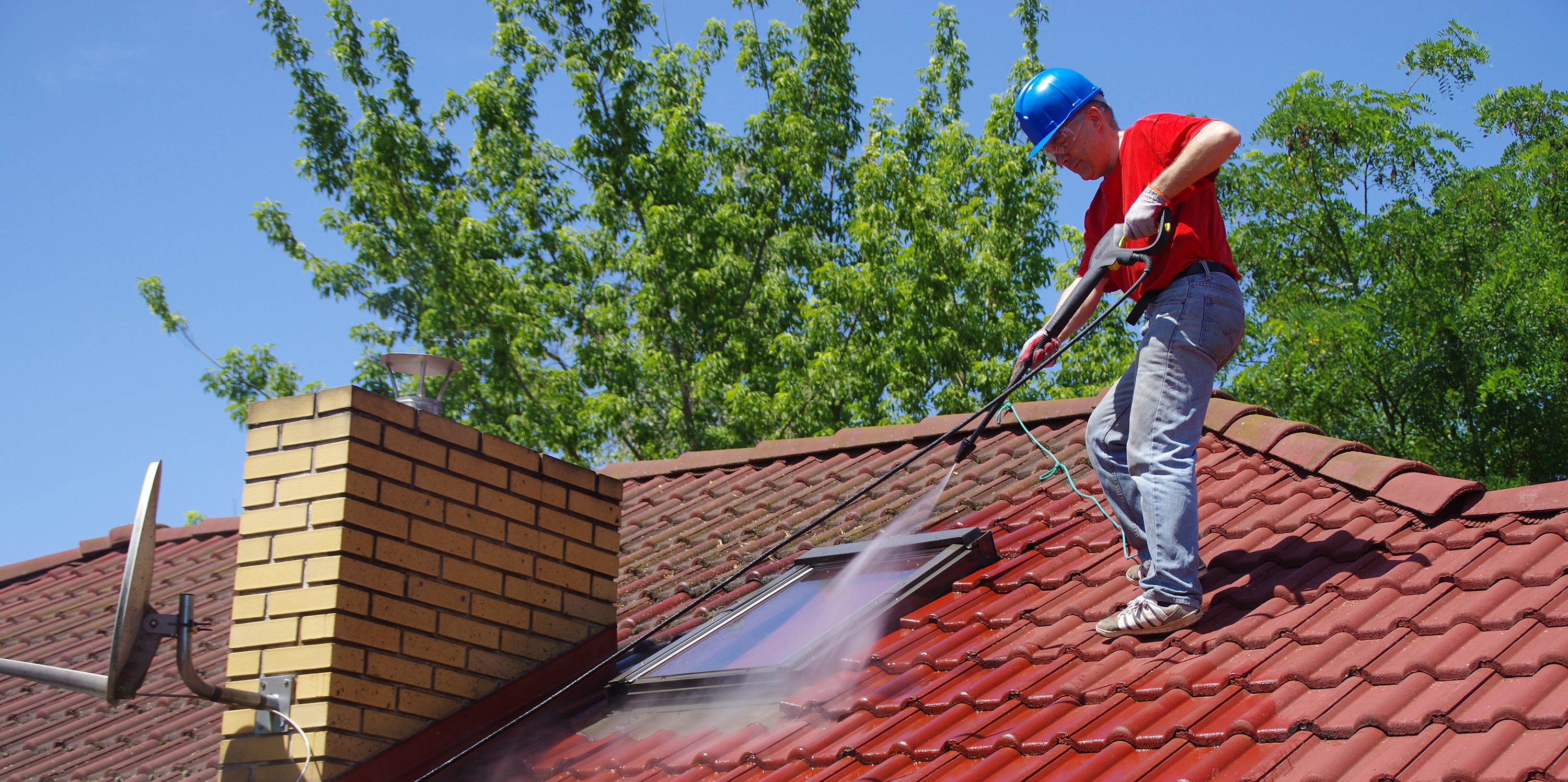 man-cleaning-roof-lg Roof cleaning roofing services in seattle